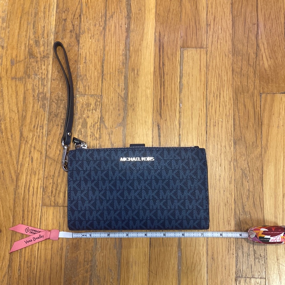 As is Michael Kors blue signature wristlet